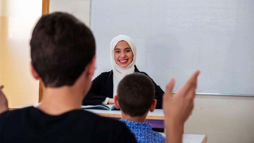 Student and teacher engage in class discussions
