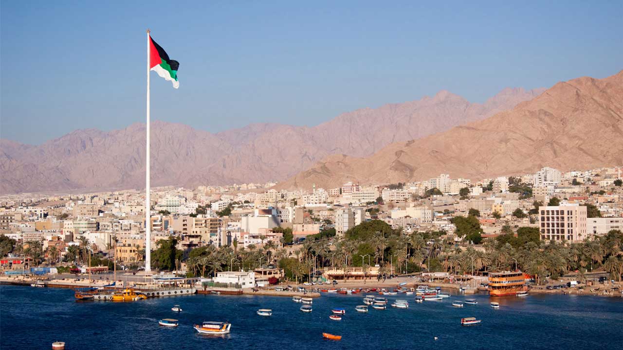View of the city of Aqaba, Jordan from the gulf of Aqaba with dry mountains in the background