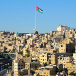 Flag of Jordan with a city view