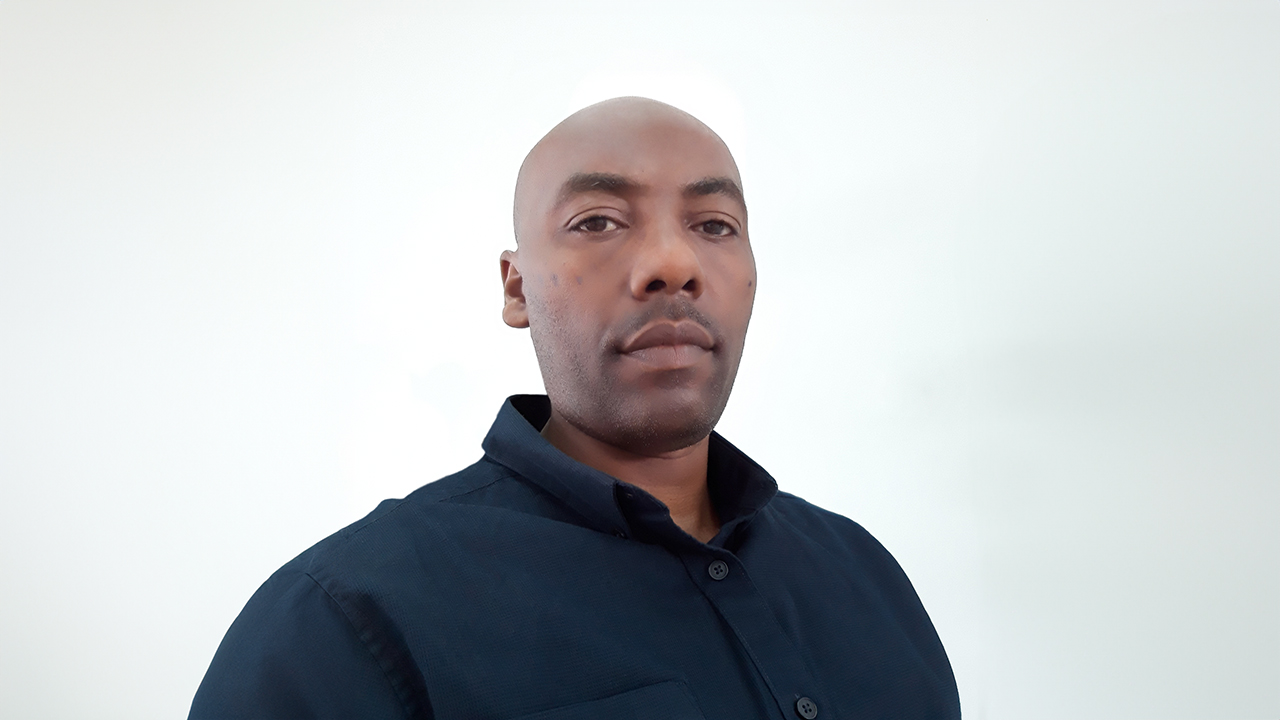 Headshot of Milkias Belay
